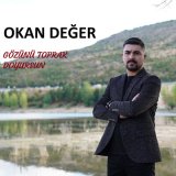 Скачать песню Okan Değer - Gözünü Toprak Doyursun